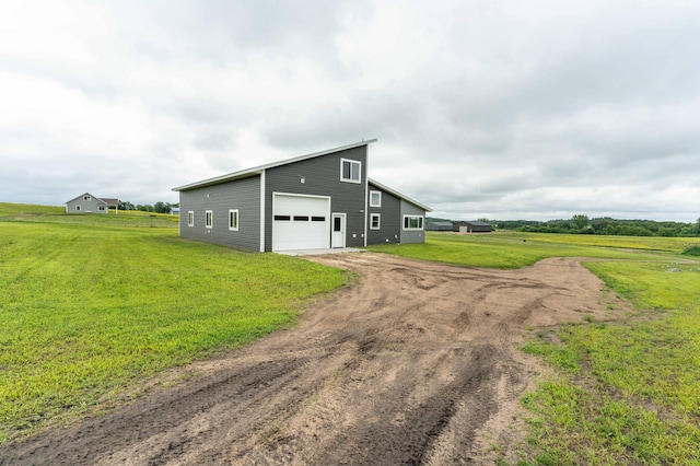 41565 Thunder Rd, Clitherall, MN 56524 - view of outbuilding with dirt driveway and a garage