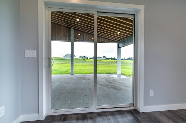 41565 Thunder Rd, Clitherall, MN 56524 - doorway featuring lofted ceiling and dark wood-style flooring
