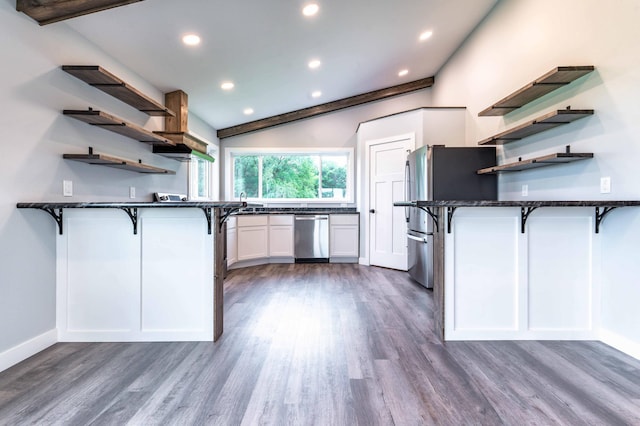 41565 Thunder Rd, Clitherall, MN 56524 - kitchen featuring open shelves, appliances with stainless steel finishes, a peninsula, a kitchen bar, and recessed lighting