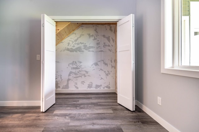 41565 Thunder Rd, Clitherall, MN 56524 - unfurnished bedroom with dark wood-type flooring and baseboards