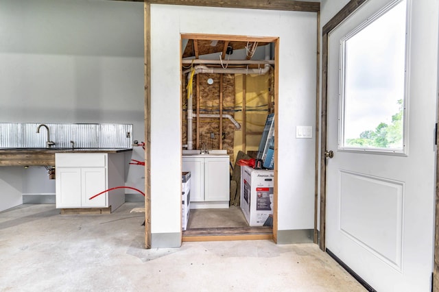41565 Thunder Rd, Clitherall, MN 56524 - interior space featuring washer and dryer and unfinished concrete flooring