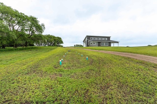 41565 Thunder Rd, Clitherall, MN 56524 - view of front of home with dirt driveway, a front lawn, and a view of countryside