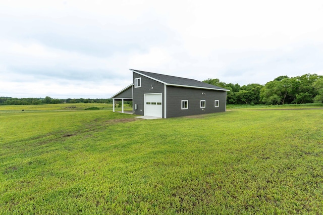 41565 Thunder Rd, Clitherall, MN 56524 - view of home's exterior featuring a lawn, an outbuilding, a detached garage, and driveway