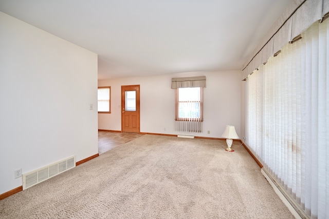 731 Clarks Ln, Winona, MN 55987 - spare room with light colored carpet and baseboard heating