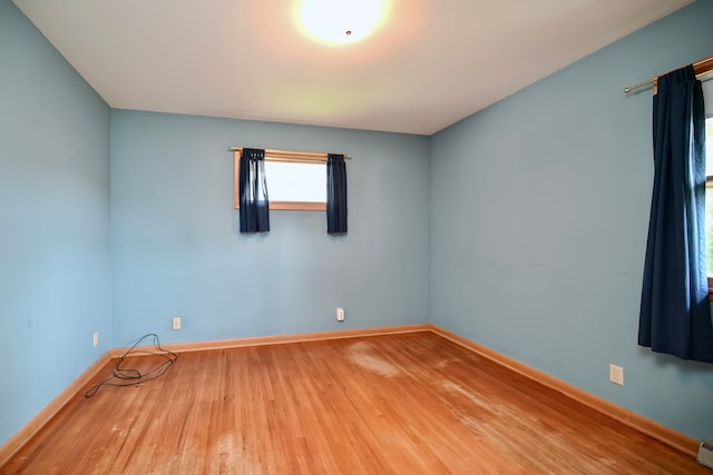 731 Clarks Ln, Winona, MN 55987 - spare room featuring wood finished floors and baseboards