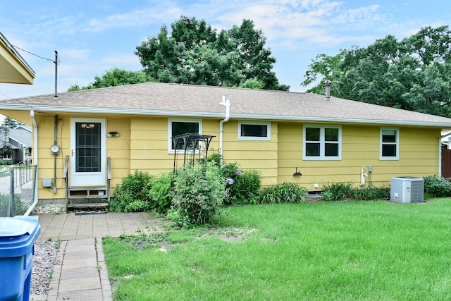 731 Clarks Ln, Winona, MN 55987 - rear view of property featuring a lawn and roof with shingles