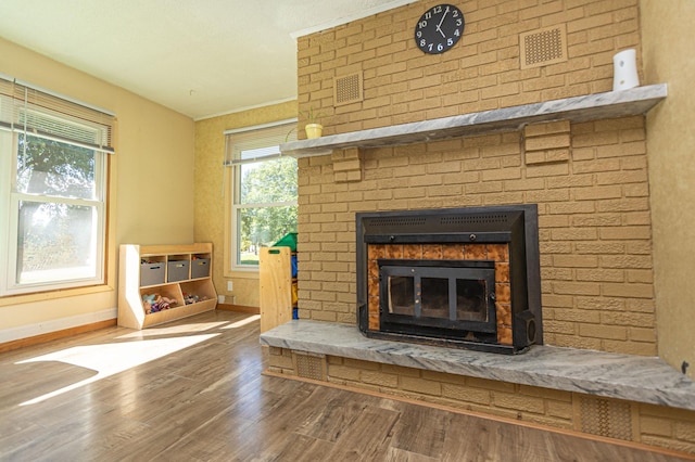 1007 Ruby St NW, Alexandria, MN 56308 - detailed view of a brick fireplace and wood finished floors