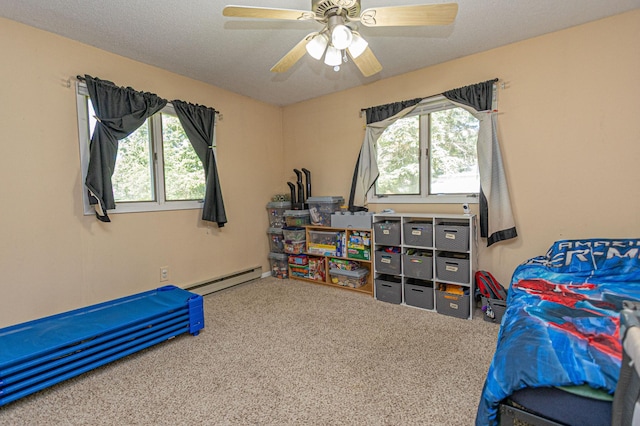 1007 Ruby St NW, Alexandria, MN 56308 - carpeted bedroom featuring a baseboard radiator and ceiling fan