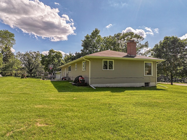 1007 Ruby St NW, Alexandria, MN 56308 - rear view of house with a lawn and a chimney