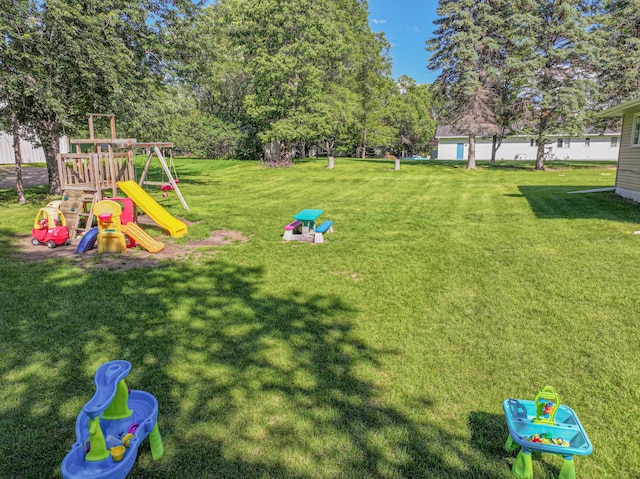 1007 Ruby St NW, Alexandria, MN 56308 - view of grassy yard featuring a playground