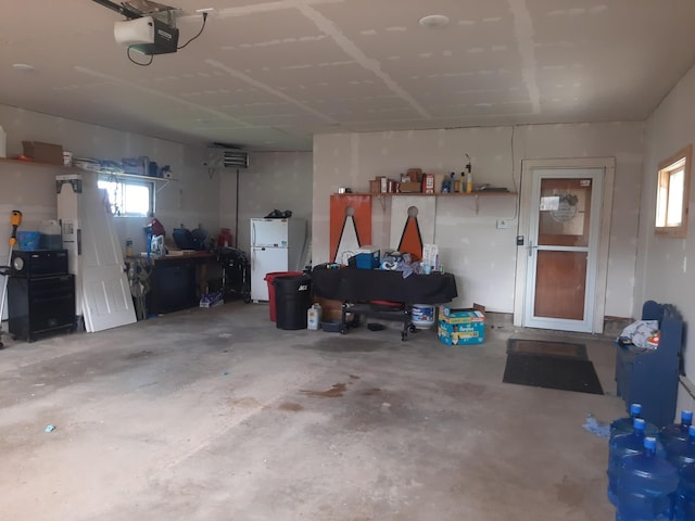 74194 415th St, South Branch Twp, MN 56081 - garage with freestanding refrigerator and a garage door opener