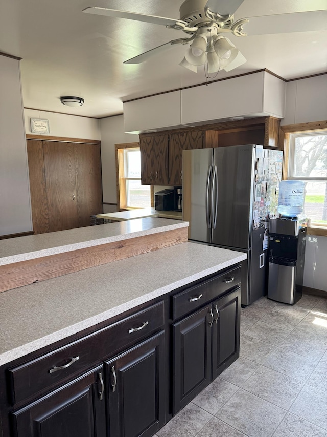 74194 415th St, South Branch Twp, MN 56081 - kitchen featuring freestanding refrigerator, light countertops, a ceiling fan, and decorative backsplash