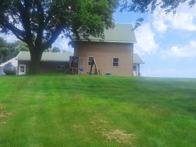74194 415th St, South Branch Twp, MN 56081 - back of property with a yard and a metal roof
