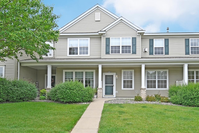 11307 Chisholm Cir NE Unit C, Blaine, MN 55449 - townhome / multi-family property with a front lawn and covered porch