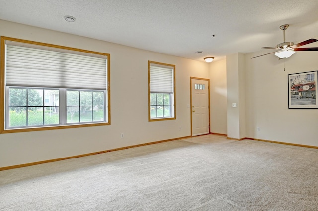 11307 Chisholm Cir NE Unit C, Blaine, MN 55449 - spare room featuring carpet flooring, a textured ceiling, and ceiling fan