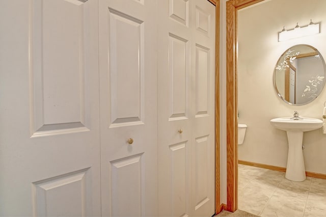 11307 Chisholm Cir NE Unit C, Blaine, MN 55449 - bathroom featuring baseboards and a sink