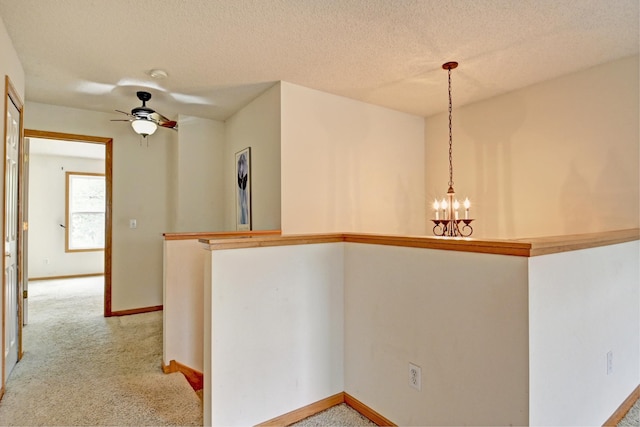11307 Chisholm Cir NE Unit C, Blaine, MN 55449 - bar area with a chandelier, light carpet, ceiling fan, decorative light fixtures, and a textured ceiling