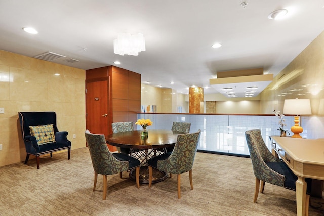 875 Lake St N Unit 318, Wayzata, MN 55391 - dining space with light carpet, recessed lighting, and tile walls