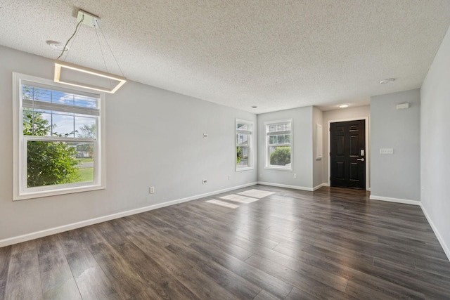 12651 8th Ave S, Zimmerman, MN 55398 - unfurnished room featuring a textured ceiling and dark wood-type flooring
