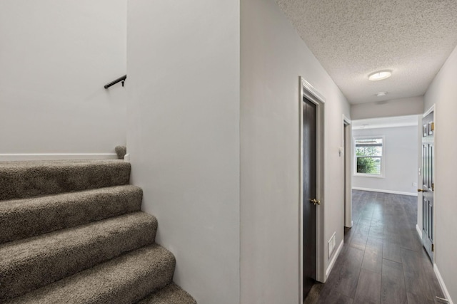 12651 8th Ave S, Zimmerman, MN 55398 - stairs with a textured ceiling and wood finished floors