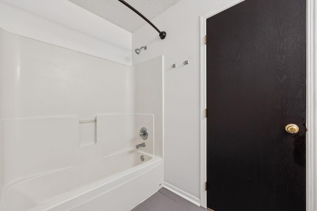 12651 8th Ave S, Zimmerman, MN 55398 - full bathroom featuring tile patterned flooring, shower / tub combination, and a textured ceiling