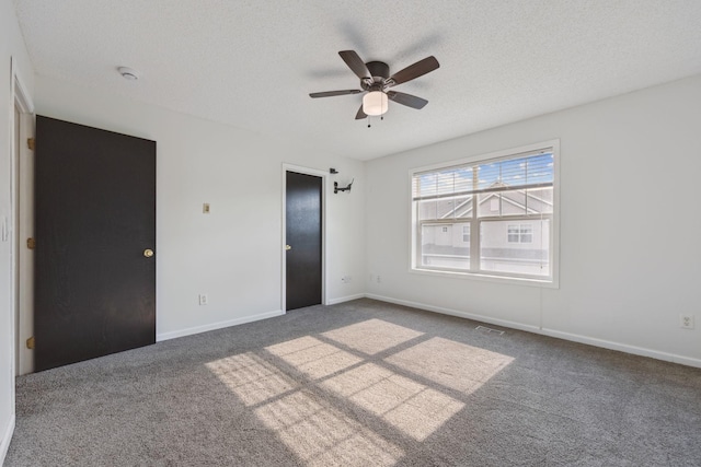 12651 8th Ave S, Zimmerman, MN 55398 - unfurnished bedroom with carpet flooring, ceiling fan, and a textured ceiling