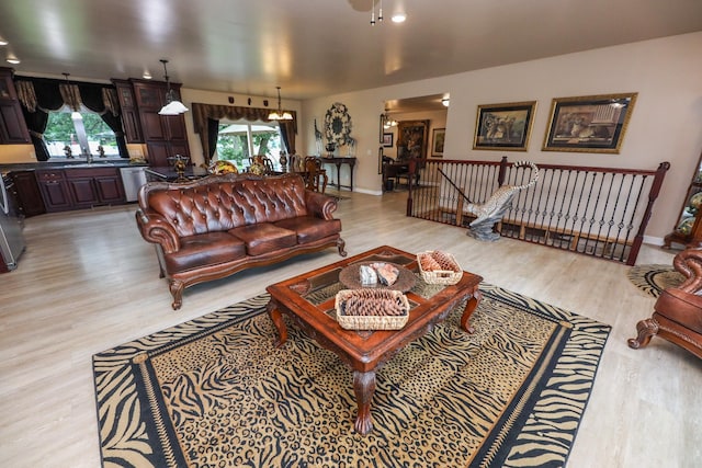 915 Darling Dr NW, Alexandria, MN 56308 - living room featuring light wood-type flooring and plenty of natural light