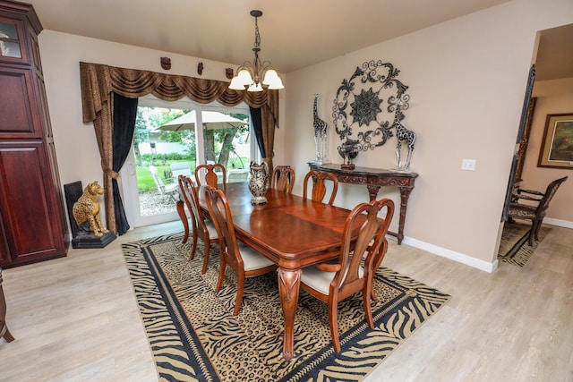 915 Darling Dr NW, Alexandria, MN 56308 - dining room featuring a chandelier and light wood-type flooring