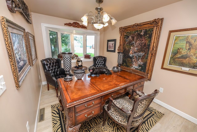 915 Darling Dr NW, Alexandria, MN 56308 - office area with light wood finished floors and a chandelier