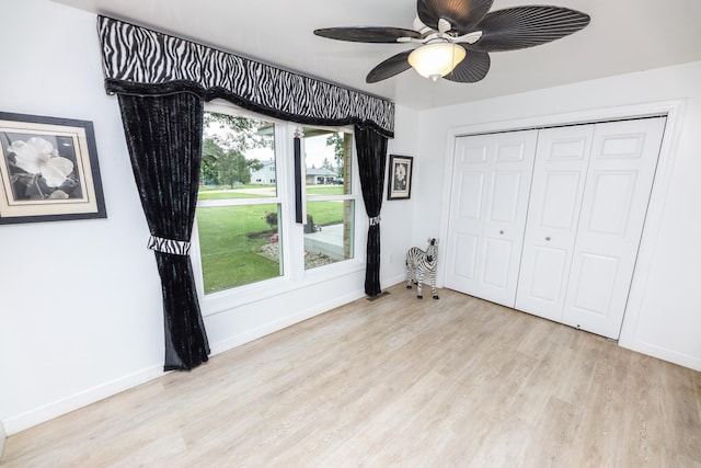 915 Darling Dr NW, Alexandria, MN 56308 - unfurnished bedroom with light wood finished floors and a closet