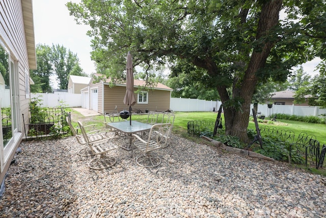 915 Darling Dr NW, Alexandria, MN 56308 - fenced backyard featuring an outbuilding and a patio