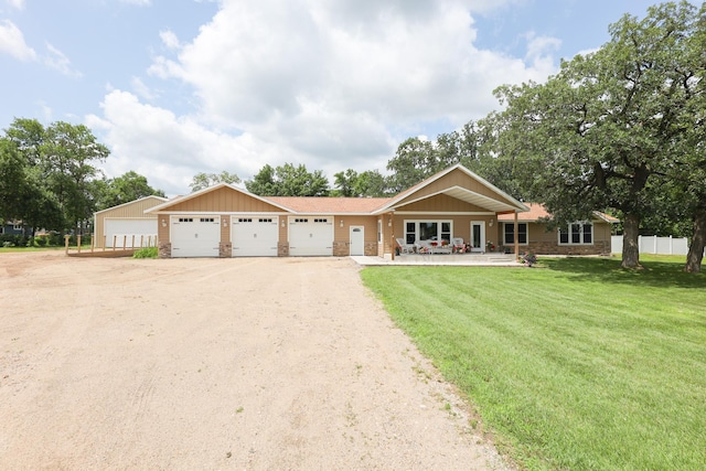 915 Darling Dr NW, Alexandria, MN 56308 - ranch-style home featuring driveway, stone siding, and an attached garage