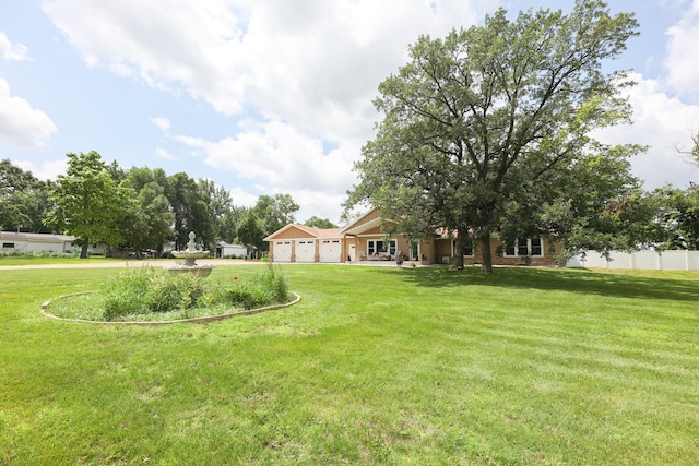 915 Darling Dr NW, Alexandria, MN 56308 - view of yard featuring an attached garage and driveway