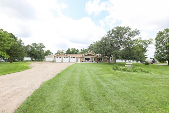 915 Darling Dr NW, Alexandria, MN 56308 - ranch-style home with dirt driveway, a front lawn, and a garage