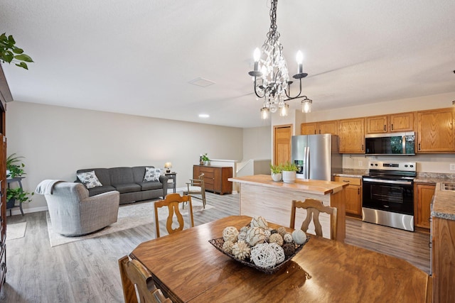 1807 Lachman Ave NE, Saint Michael, MN 55376 - dining space featuring a chandelier and light wood-style flooring