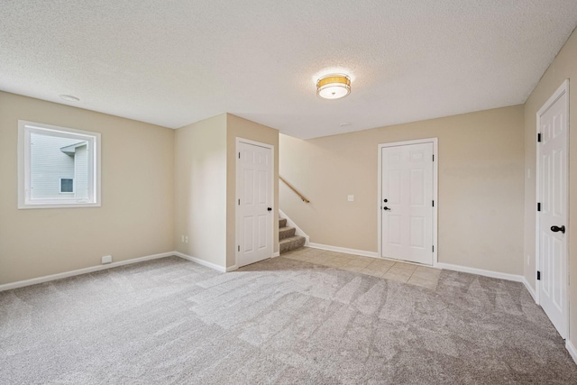 1807 Lachman Ave NE, Saint Michael, MN 55376 - unfurnished room with light colored carpet, a textured ceiling, and stairway