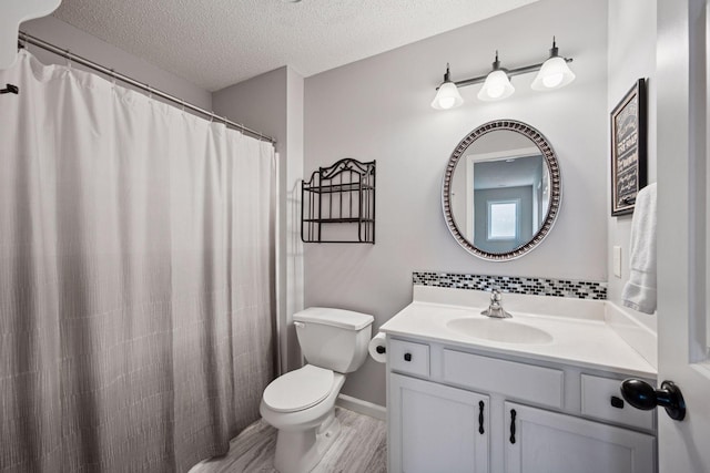 1807 Lachman Ave NE, Saint Michael, MN 55376 - full bathroom featuring vanity, a textured ceiling, and wood finished floors