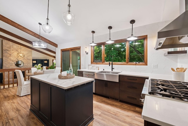 6205 Saint Albans Cir, Edina, MN 55439 - kitchen with wall chimney exhaust hood, light wood-type flooring, a center island, and tasteful backsplash