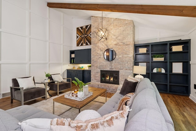 6205 Saint Albans Cir, Edina, MN 55439 - living area with a decorative wall, wood finished floors, and a fireplace