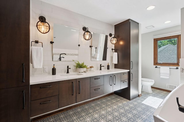 6205 Saint Albans Cir, Edina, MN 55439 - bathroom with double vanity, decorative backsplash, recessed lighting, a tub, and a shower