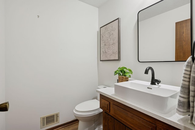 6205 Saint Albans Cir, Edina, MN 55439 - half bathroom featuring vanity and wood finished floors
