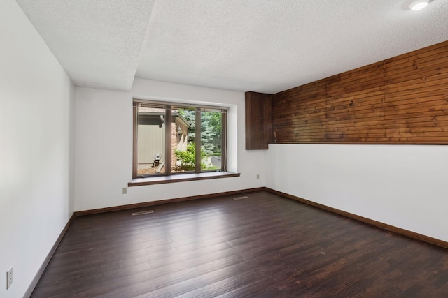 6205 Saint Albans Cir, Edina, MN 55439 - empty room featuring dark wood finished floors and a textured ceiling