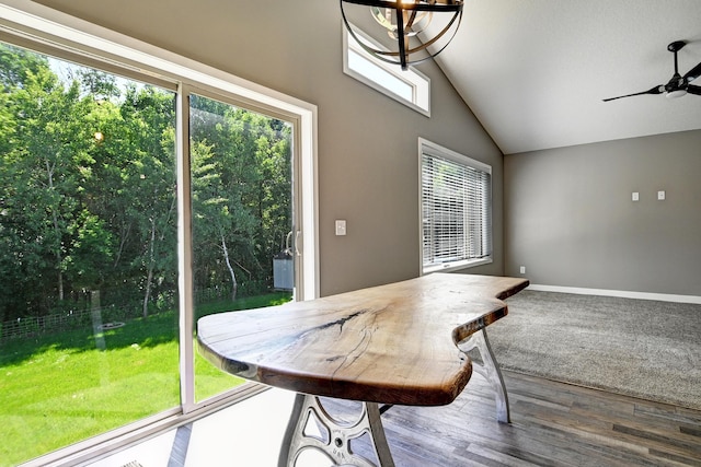 38391 Hunters Ridge Trl, North Branch, MN 55056 - dining area featuring lofted ceiling, ceiling fan, wood finished floors, and a chandelier