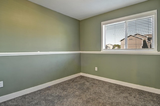 38391 Hunters Ridge Trl, North Branch, MN 55056 - unfurnished room with dark carpet and baseboards