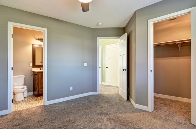 38391 Hunters Ridge Trl, North Branch, MN 55056 - unfurnished bedroom featuring a spacious closet, a closet, carpet flooring, and ensuite bath