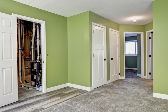 38391 Hunters Ridge Trl, North Branch, MN 55056 - unfurnished bedroom with a closet and wood finished floors