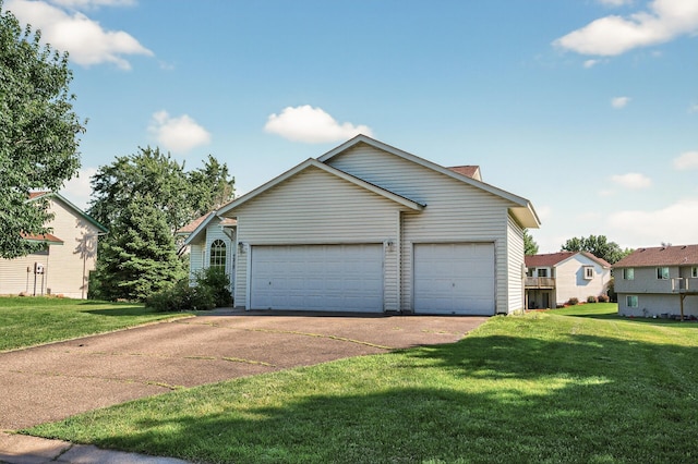 7217 92nd Trl N, Brooklyn Park, MN 55445 - view of front of home featuring concrete driveway, a front lawn, and a garage