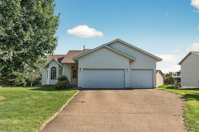 7217 92nd Trl N, Brooklyn Park, MN 55445 - view of front facade featuring concrete driveway, an attached garage, a front lawn, and a shingled roof
