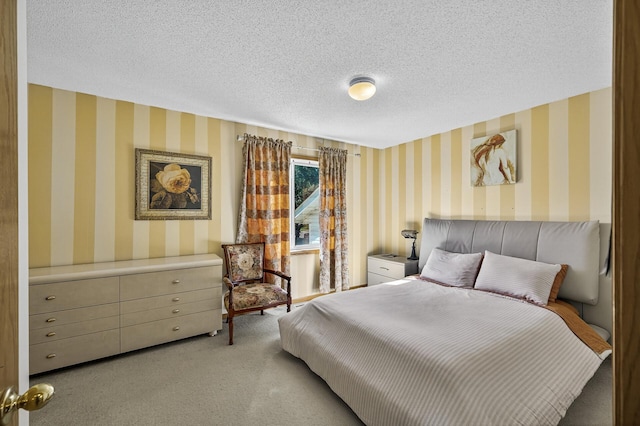 7217 92nd Trl N, Brooklyn Park, MN 55445 - bedroom featuring wallpapered walls, light colored carpet, and a textured ceiling