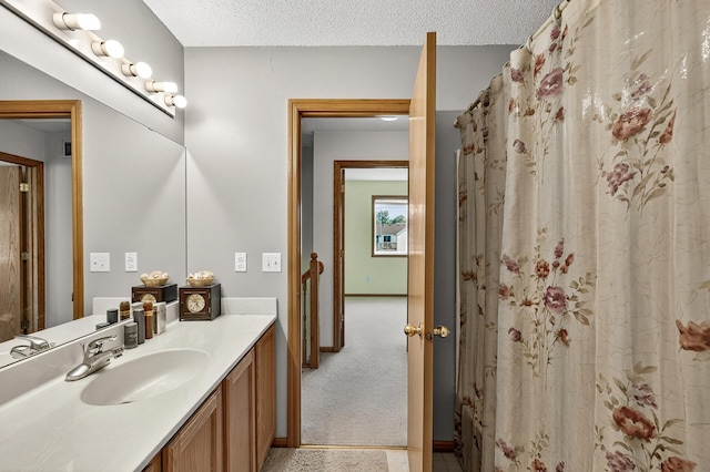 7217 92nd Trl N, Brooklyn Park, MN 55445 - bathroom featuring vanity and a textured ceiling